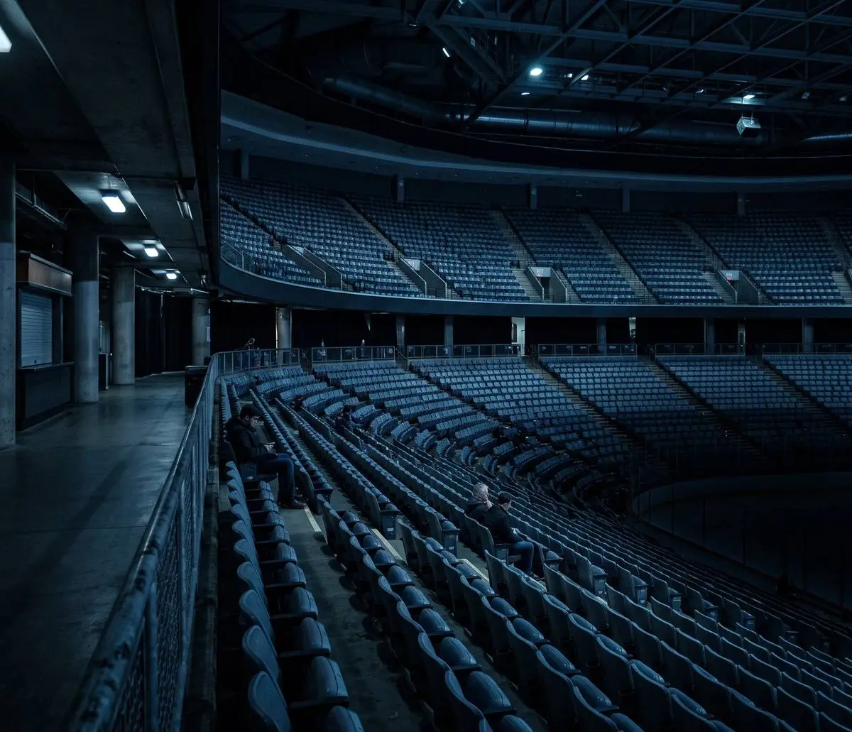 A near empty arena bowl on a weeknight, three people in the stands
